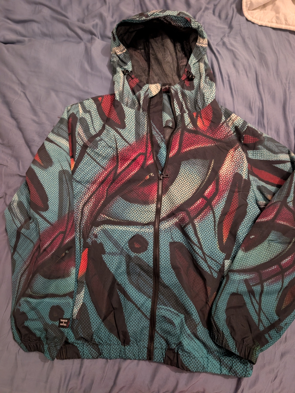 Tango Hotel x ABSTRK collaboration hooded windbreaker, size M.